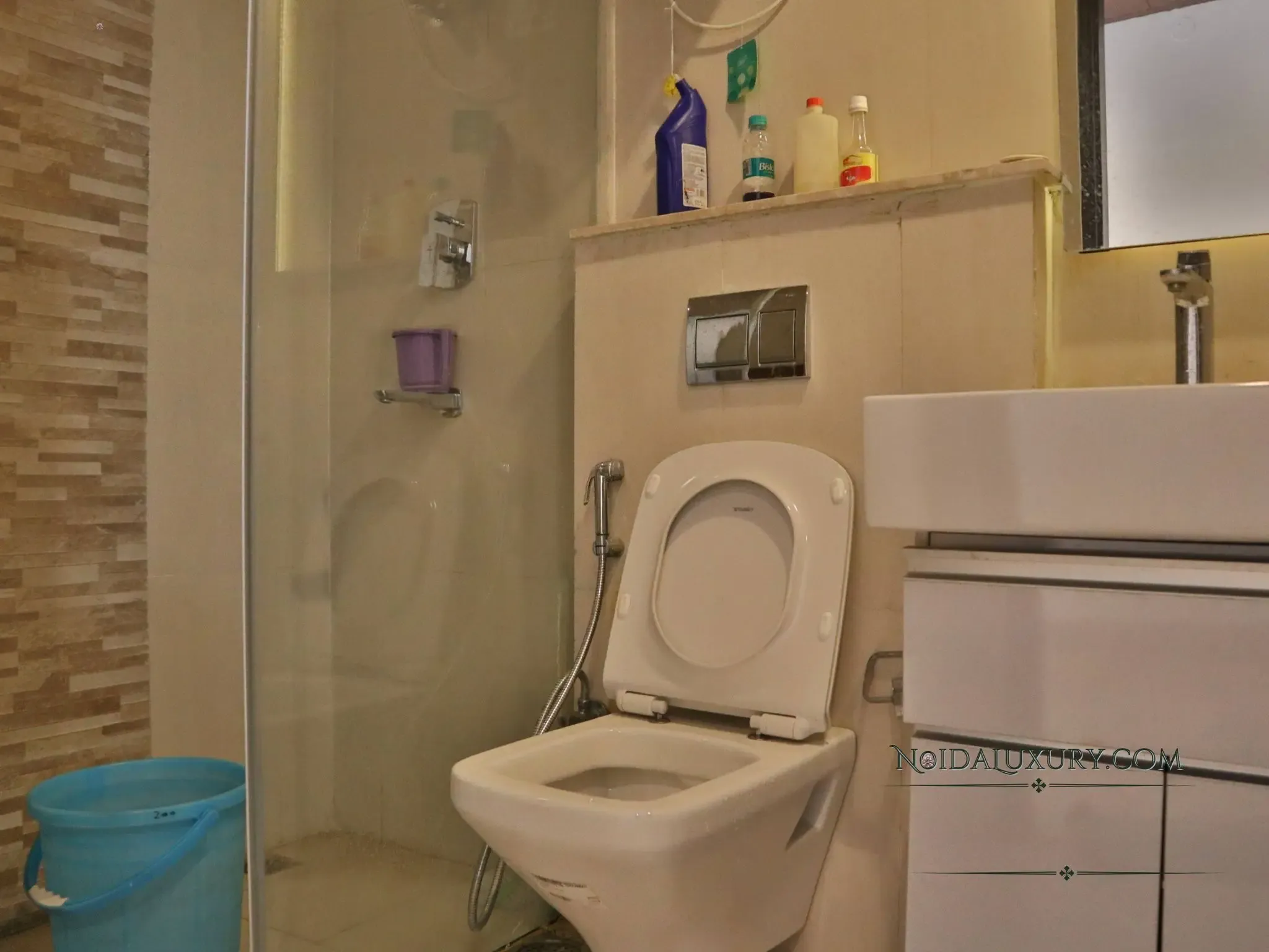 Luxury bathroom in 3 BHK Supernova apartment – premium fittings and shower enclosure